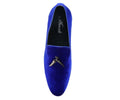 Blue velvet loafer with a decorative buckle on a white background