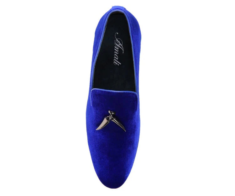 Blue velvet loafer with a decorative buckle on a white background