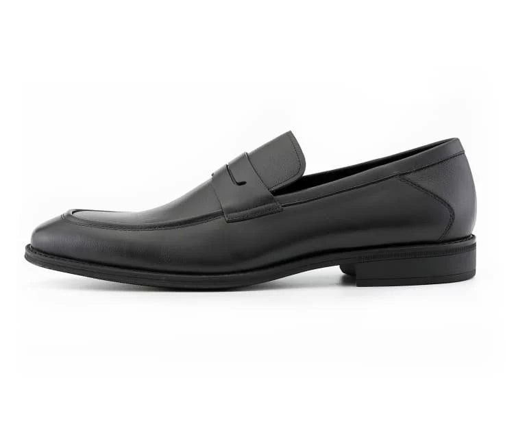 Black leather loafer shoe on a white background