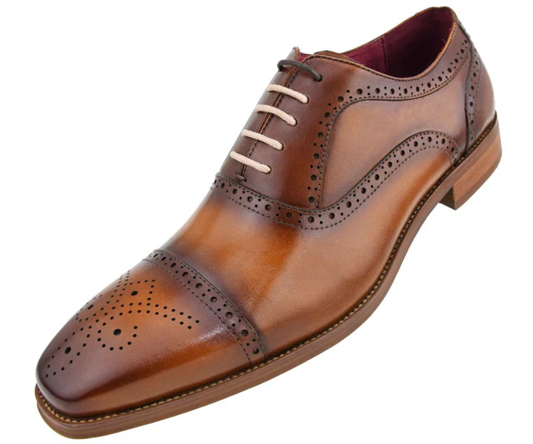 Brown leather dress shoe on a white background