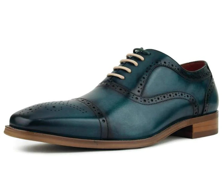 turquoise leather dress shoe with brown sole on a white background