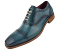 turquoise leather dress shoe with brown soles on a white background
