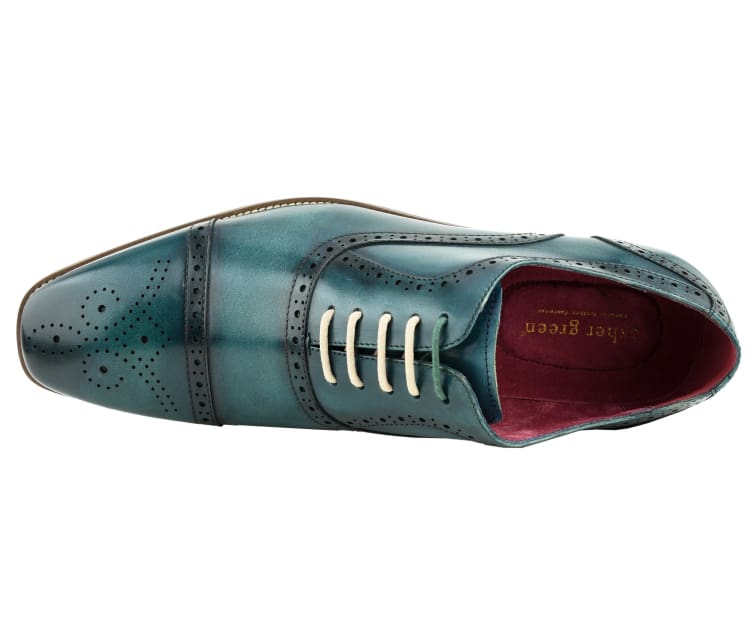 turquoise leather dress shoe with white laces on a white background